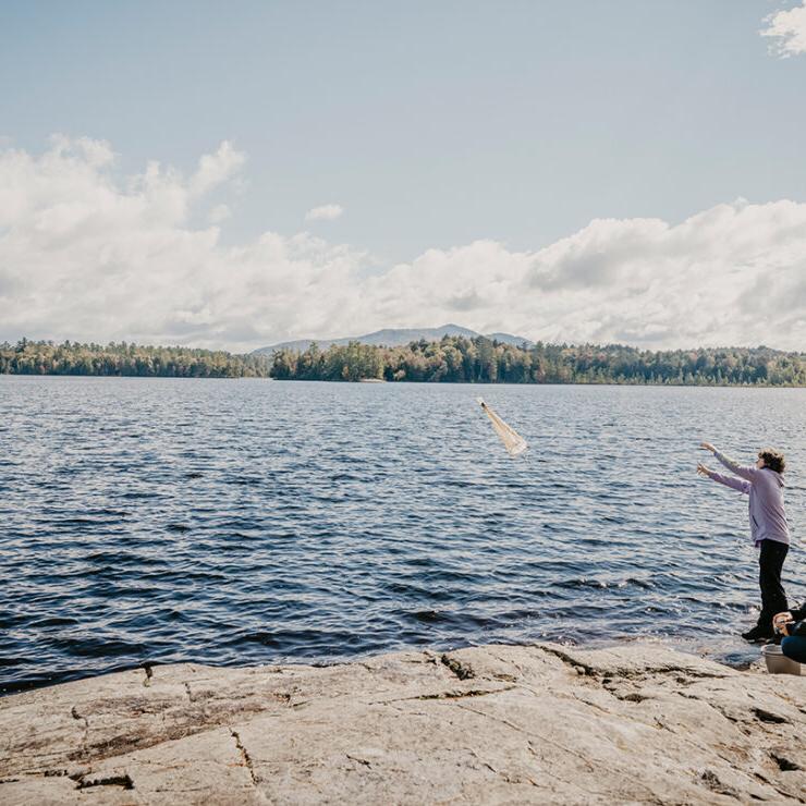 Paul Smith's students studying lakeside near the Paul Smith's College campus